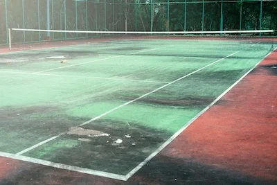 Tennis court pressure washing to remove moss and dirt