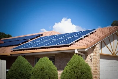 Pressure washing and cleaning windows, solar panels and gutters
